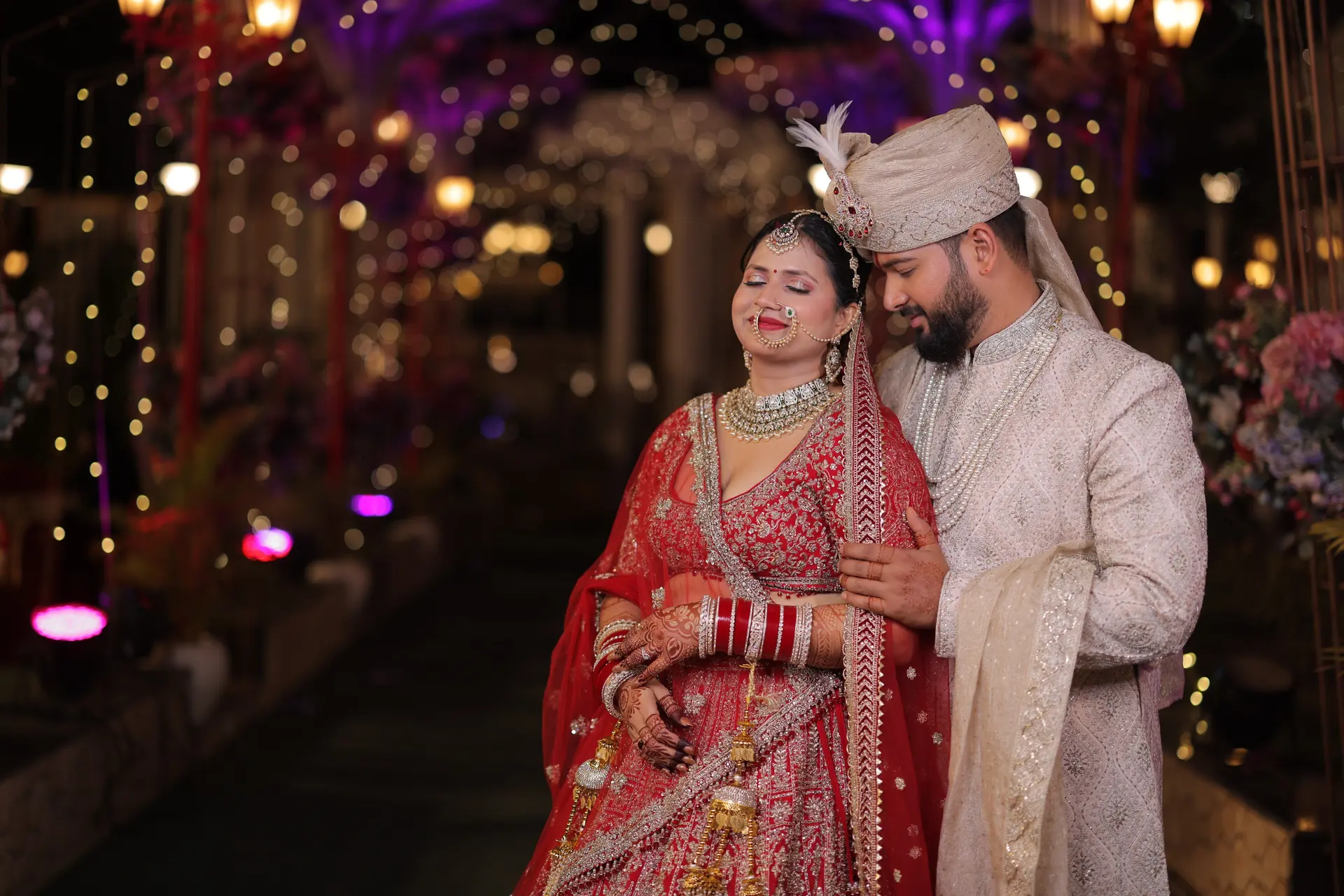 Couple under purple lit arches